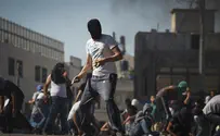 Policeman Suspended for Beating Rioter