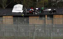 Reuters Migrants riot, burn holding facility in Australia