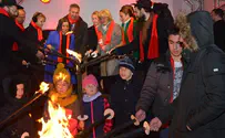 Watch: Syrian refugee children light Europe's largest Hanukkiah