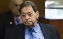 Former defense minister denies bribery charges in court
