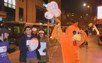 Giving out balloons in protest of Supreme Court's 'inflated ego'
