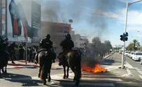 Watch: Policeman pulls a gun on haredi extremists