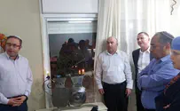 Lighting the menorah, keeping a promise