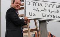 Jerusalem municipality spokesperson Jerusalem mayor hangs sign directing traffic to US Embassy