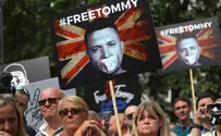 Police flee during massive London protest for arrested leader