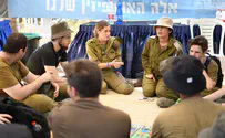 Jerusalem March participants pass through IDF sukkot