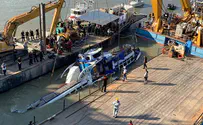 Salvage teams work to raise sunken boat to Danube surface