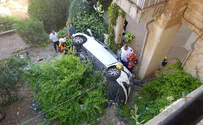 Woman injured after car falls 2 stories from parking lot