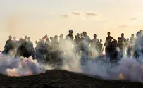 Gaza rioters throw rocks and explosives at IDF soldiers