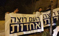 MK Hendel speaks to protesters outside his home