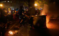 Tires slashed, fireworks shot, protesters brandishing handguns