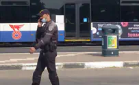 Policeman enforcing mask guidelines only covers his chin