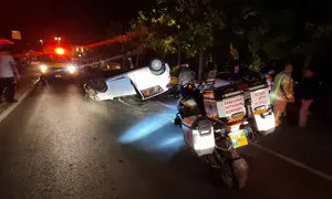 Man survives car crash - and is killed by police car