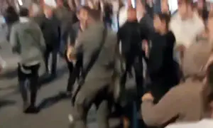 Police officer stomps on protester's head