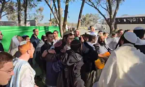 Watch: Youth group members sing at the scene of the Nova Massacre