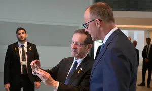 Herzog and German Chancellor watch release of Edan Alexander