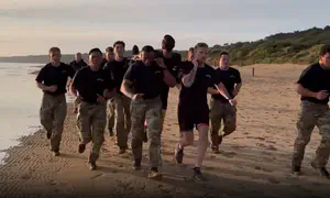 Defense Sec. Hegseth led a workout this morning on Omaha Beach
