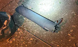 Missile debris falls on building