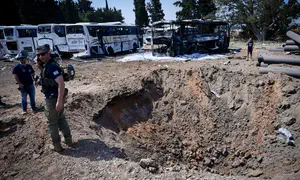Bedouins steal fuel from busses damaged by missile