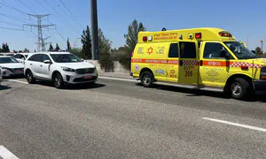 Man killed by passing car while receiving medical treatment