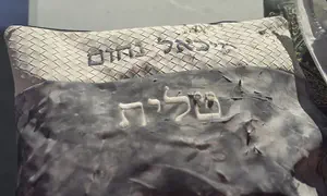 Miki Nahum's tefillin found intact in Bat Yam rubble