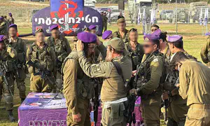 Father of fallen soldier presents berets to haredi soldiers