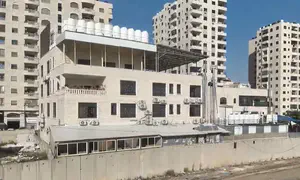 Illegal building becomes part of security barrier