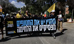 Leftist protesters set garbage cans on fire near PM's residence