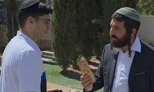 MK Succot distributes chocolate to haredi enlistees