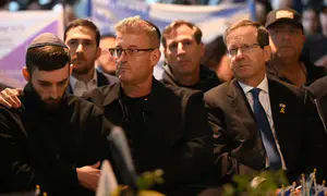 Released hostage Matan Angrest attends commander's funeral