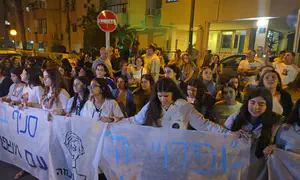 11 years ago and today, neighbors sing outside the Goldins' home