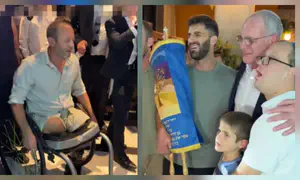 Wounded vet and Amb. Leiter dance with the Torah