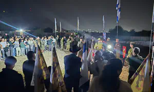 IDF soldiers light Hanukkah candles at Hasmonean Palaces