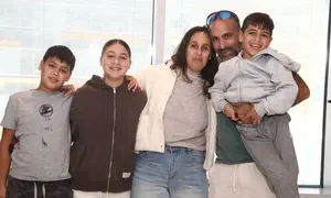 Watch: Freed hostages come full circle in moving candle-lighting