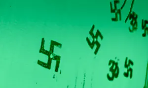 Father, son arrested after swastika probe uncovers explosives