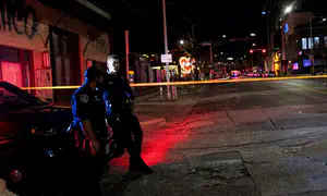 Gunman with Iranian flag clothing kills two in Texas