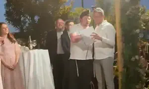 Seriously injured soldier says blessing at friend's wedding