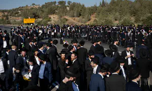 Haredi protesters paralyze trains and roads