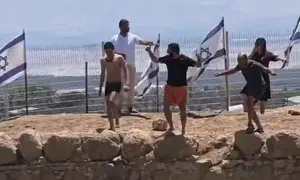 Tzvi Succot jumps into Herod's Pool