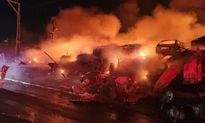 Firefighting crews battle blaze at vehicle lot in Kiryat Arba