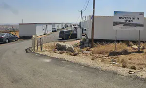 Families return to Migron, outpost connected to power grid