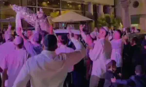 Nova massacre survivors dance with Torah scrolls
