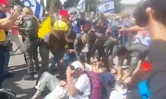 Demonstrator commits indecent act on female officer