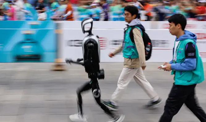 Humanoid robots compete against humans in half marathon