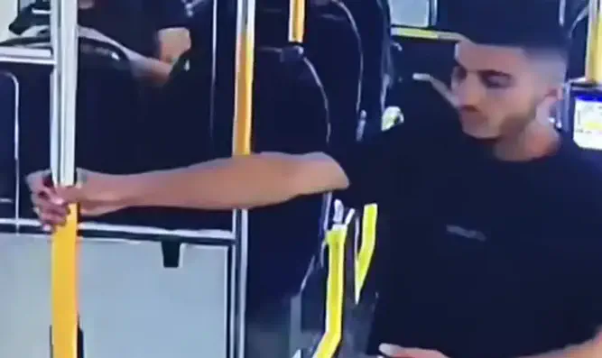 Arab youth spits at female IDF officer on bus