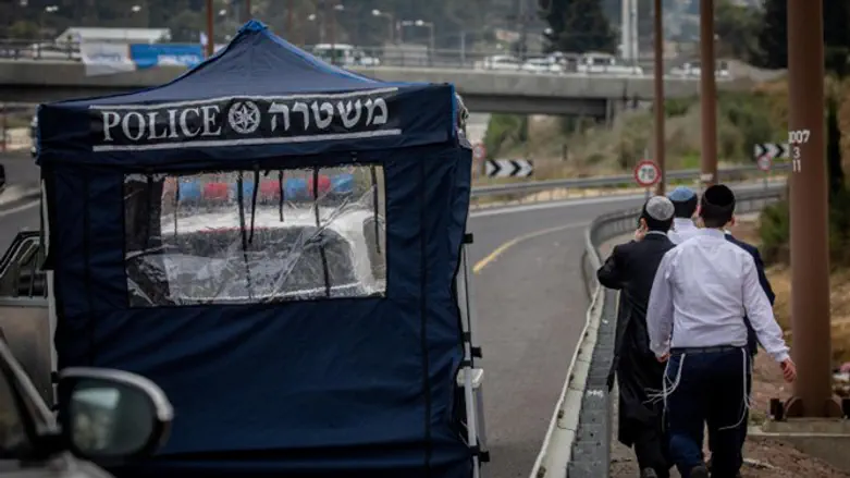 People enter Jerusalem by foot, passing checkpoint