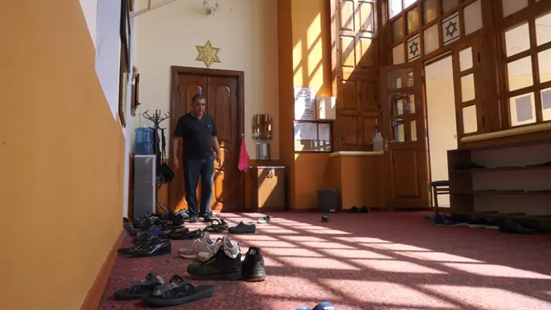 A man enters the Six Dome Synagogue of Krasnaiya Sloboda, Azerbaijan, July 2018