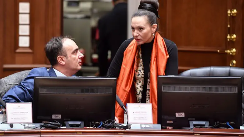 Rashela Mizrahi speaks to a colleague during a cabinet meeting in Skopje