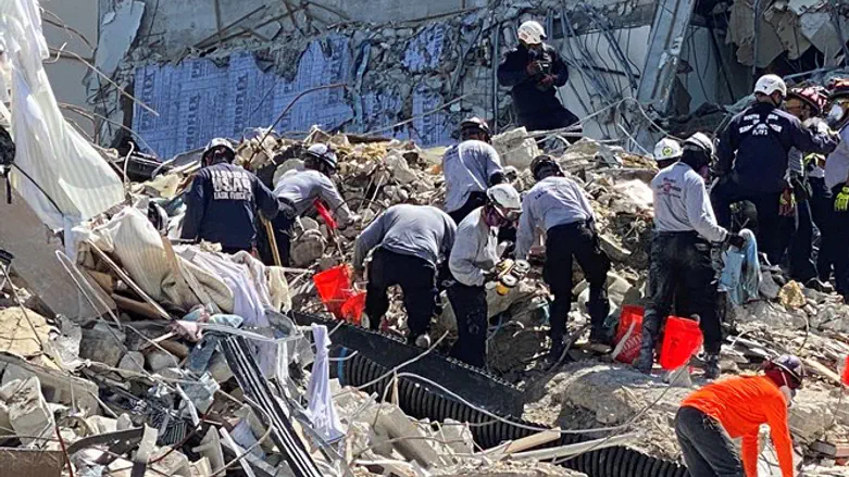 Rescue workers at the site of the Surfside, Florida, collapse