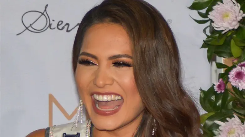 Miss Universe 2021 Andrea Meza of Mexico laughs during a news conference on her